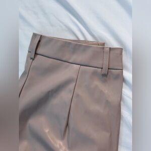 This elegant piece is size M, Color: beige or cream